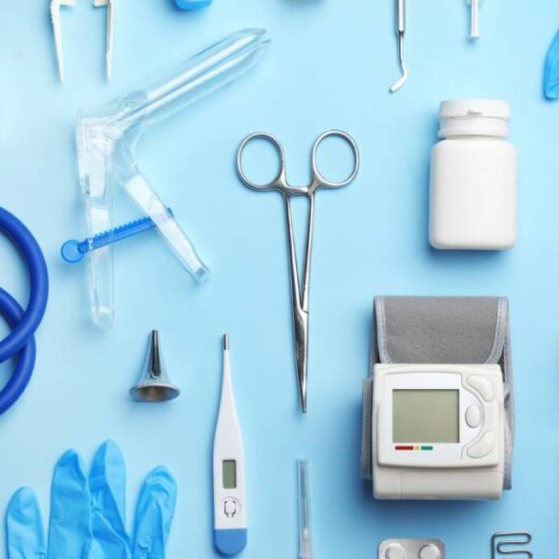 Flat lay composition with medical objects on color background